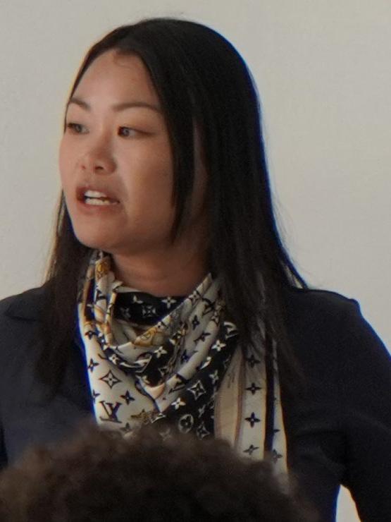 A Photo of Associate Professor Sherry Yu teaching a class.